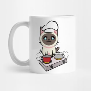 Cute Siamese cat is cooking Mug